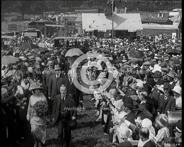 A Group of Politicians Walking Through a Large Crowd of People, 1920s. Creator: British Pathe Ltd.