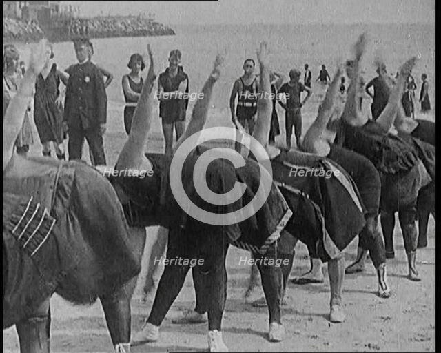 A Group of Plus Size Female Civilians Exercising on a Beach, 1920. Creator: British Pathe Ltd.