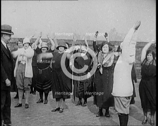 A Group of Plus Size Female Civilians Exercising on a Beach, 1920. Creator: British Pathe Ltd.