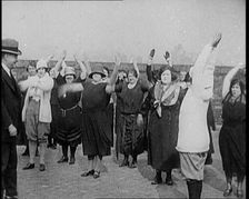 A Group of Plus Size Female Civilians Exercising on a Beach, 1920. Creator: British Pathe Ltd