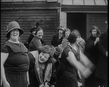 A Group of Plus Size Female Civilians Exercising on a Beach, 1920. Creator: British Pathe Ltd