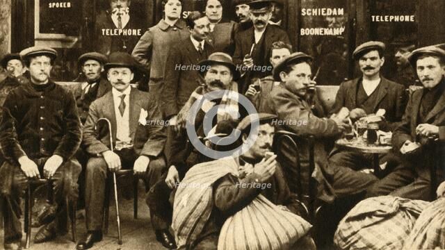 'A group of refugee field-workers at a café in Paris', First World War, 1914-1918, (1933).  Creator: Unknown.