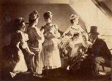 A Group of Six Costumed Women Posed in Interior with Top Hatted Gentlemen, c1885. Creator: Unknown