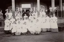 A group of students from the Maiden Institute with teachers on the porch of the dacha, 1900. Creators: I. A. Podgorbunskii, V. I. Podgorbunskii