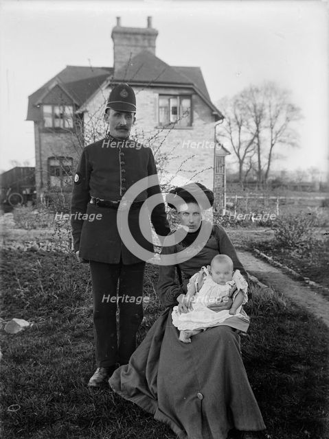 A group portrait of a policeman and his family, Warwickshire, 1905. Artist: A Newton