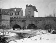 A group skating on the frozen River Thames, Abingdon Bridge, Abingdon, Oxfordshire, c1860-c1922. Artist: Henry Taunt