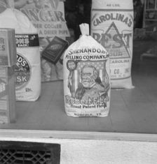 A grocery window, 1939. Creator: Dorothea Lange