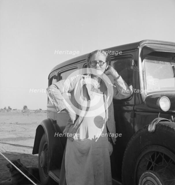 A grandmother from Oklahoma. She works in the California pea fields. Calipatria, California, 1939. Creator: Dorothea Lange.