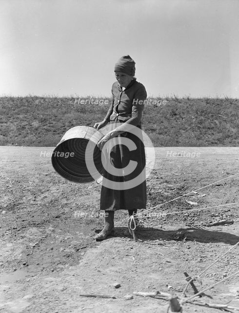 A grandmother in a migrant camp, Stanislaus County, California, 1939. Creator: Dorothea Lange.
