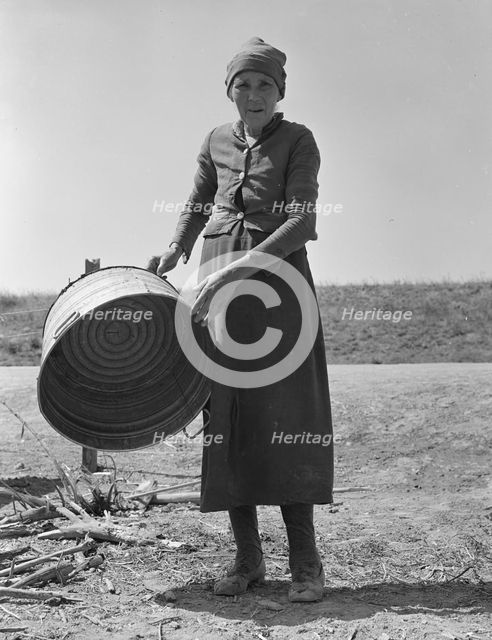 A grandmother in a contractor's camp, Stanislaus County, California, 1939. Creator: Dorothea Lange.