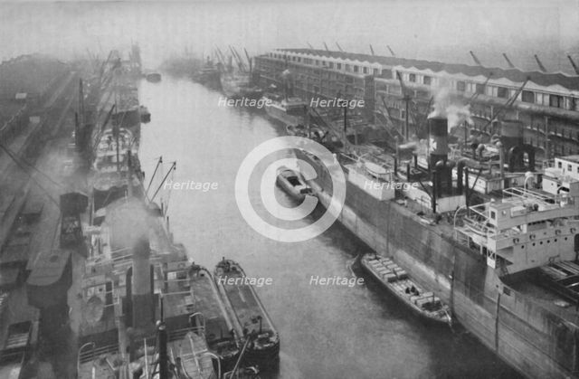 'A Great Dockland of the North, Thirty-Four Miles from Sea and Yet a Port', c1935. Artist: Manchester Ship Canal Company.