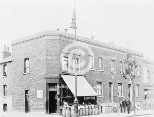 A greengrocer's shop on a street corner. Artist: Unknown