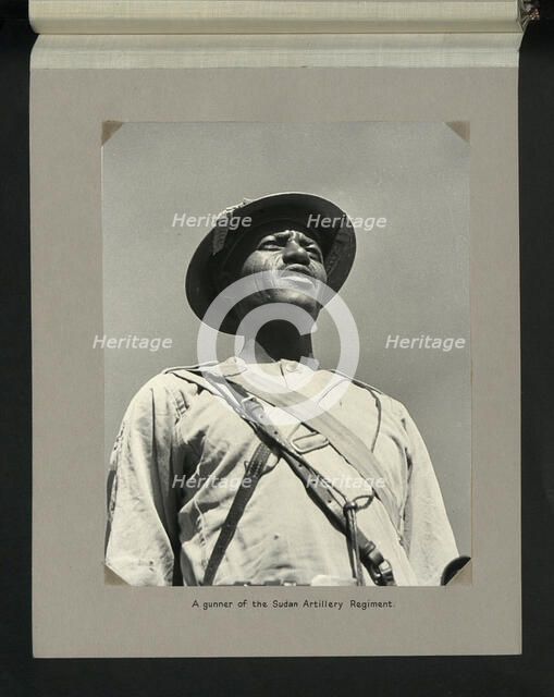 A gunner of the Sudan Artillery Regiment, 1964. Creators: Colonial Office, Unknown.