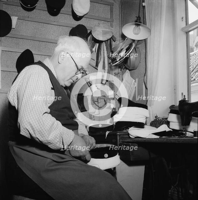 A hatter making a cap, Landskrona, Sweden, 1949. Artist: Unknown