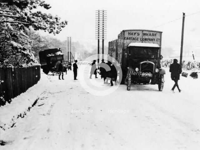 A Hay's Wharf Cartage Company Ltd van along a snowy A30, near Basingstoke, Hampshire, 1920s. Artist: Unknown