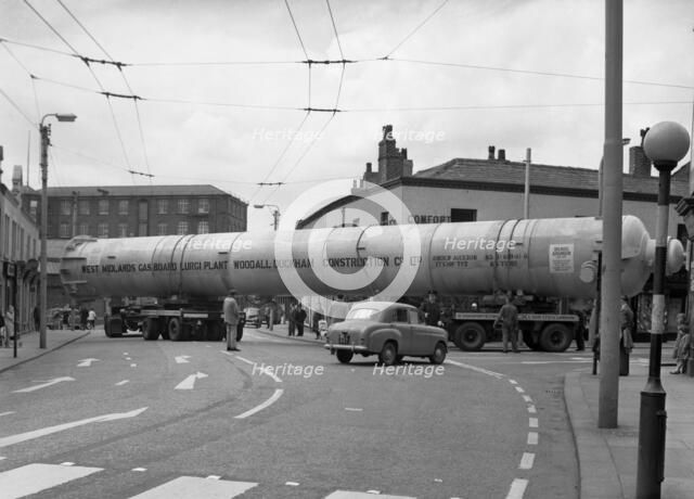 A heavy load stops the Manchester traffic, 1962.  Artist: Michael Walters