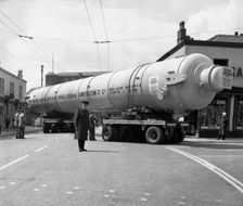 A heavy load stops the Manchester traffic, 1962. Creator: Michael Walters