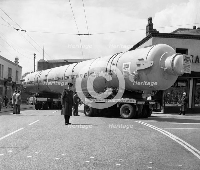 A heavy load stops the Manchester traffic, 1962.  Creator: Michael Walters.