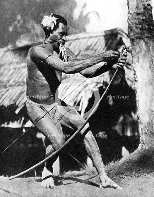 A huntsman stringing his bow, 1936.Artist: Wide World Photos