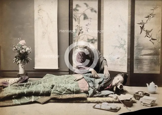 A Japanese woman being massaged by a blind Japanese masseur, c1890s. Creator: Unknown.