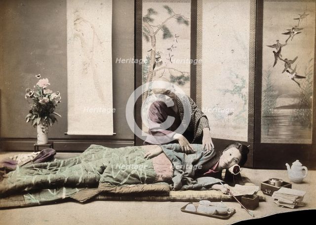 A Japanese woman being massaged by a blind Japanese masseur, c1890s. Creator: Unknown.