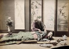 A Japanese woman being massaged by a blind Japanese masseur, c1890s. Creator: Unknown