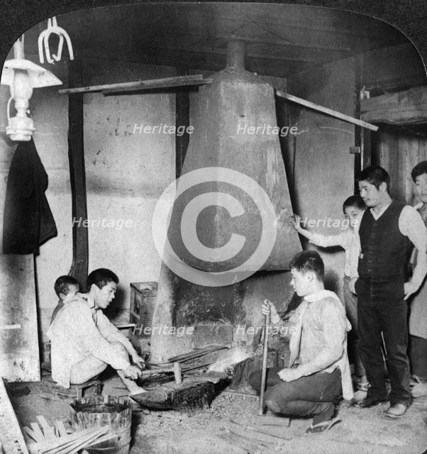 A Japanese blacksmith at his forge, Yokohama, Japan, 1904.Artist: Underwood & Underwood