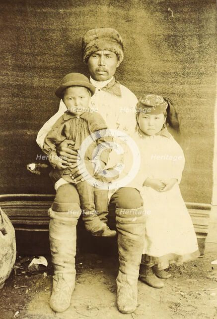 A Kachin Individual (over 30 Years Old). Tanzybaev with Children. Village of Ust'-Abakan, 1894. Creator: Unknown.
