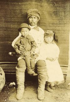 A Kachin Individual (over 30 Years Old). Tanzybaev with Children. Village of Ust'-Abakan, 1894. Creator: Unknown