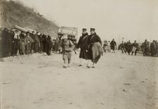 A Korean coolie carrying medical supplies from shore to hospital at Chemulpo, c1904. Creator: Robert Lee Dunn