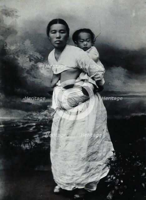 A Korean (?) woman, carrying a baby on her back, approx 1900. Creator: Unknown.
