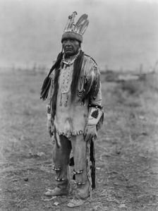 A Klamath in costume, c1923. Creator: Edward Sheriff Curtis