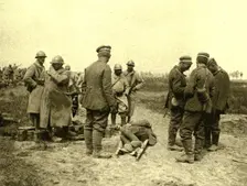 A l'est de Montdidier; Halte de prisonniers allemands ramenant un blesse 1918. Creator: Unknown