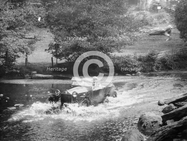 A Lancia Lambda being driven through water, c1925. Artist: Unknown
