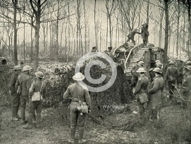 'A Landship Bringing in Under Camouflage a 5.9 German Naval Gun', (1919). Creator: Unknown.