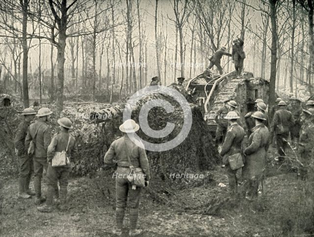'A Landship Bringing in Under Camouflage a 5.9 German Naval Gun', (1919). Creator: Unknown.
