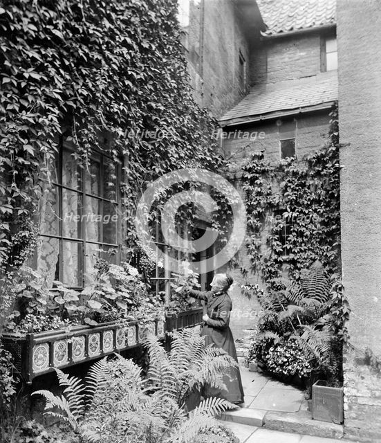 A lady gardener, c1860-c1922. Artist: Henry Taunt