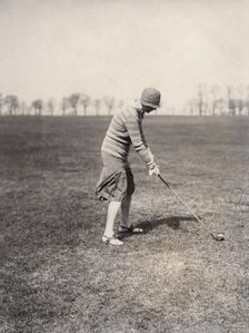 A lady golfer playing at Falsterbo Colf Club, Sweden. Artist: Otto Ohm