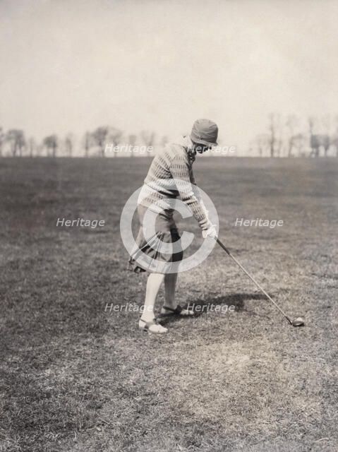 A lady golfer playing at Falsterbo Colf Club, Sweden. Artist: Otto Ohm