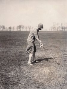A lady golfer playing at Falsterbo Colf Club, Sweden. Creator: Otto Ohm