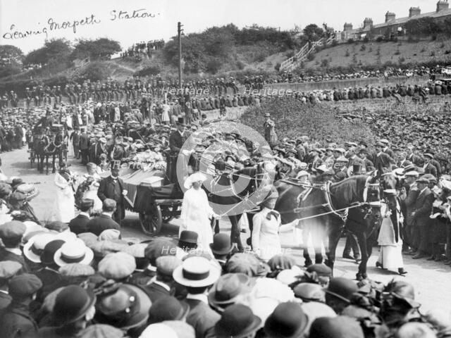 A large crowd watches Emily Wilding Davison's funeral procession 15th June 1913. Artist: Unknown