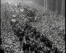 A Large Crowd Watching a Ticker Tape Parade in New York City, 1926. Creator: British Pathe Ltd