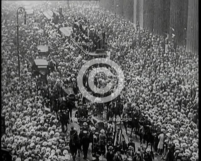 A Large Crowd Watching a Ticker Tape Parade in New York City, 1926. Creator: British Pathe Ltd.