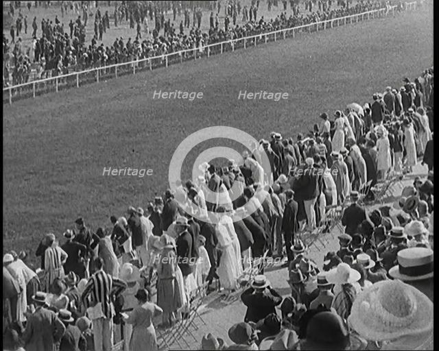 A Large Crowd of Civilians Watching a Horse Race, 1920. Creator: British Pathe Ltd.
