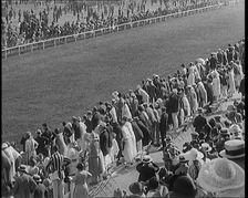 A Large Crowd of Civilians Watching a Horse Race, 1920. Creator: British Pathe Ltd