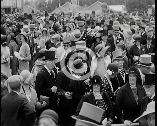 A Large Crowd of Smartly Dressed People in Hats at Ascot Horse Racing Track, 1931. Creator: British Pathe Ltd.