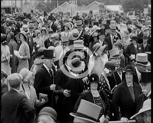 A Large Crowd of Smartly Dressed People in Hats at Ascot Horse Racing Track, 1931. Creator: British Pathe Ltd.