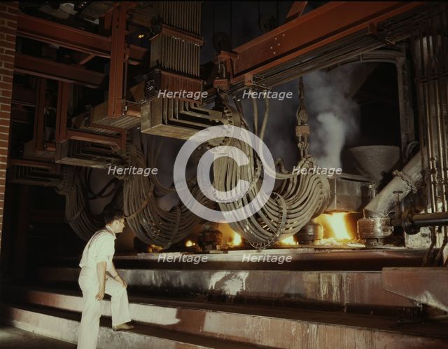 A large electric phosphate smelting furnace used in the making...Muscle Shoals area, Alabama, 1942. Creator: Alfred T Palmer.