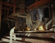 A large electric phosphate smelting furnace used in the making...Muscle Shoals area, Alabama, 1942. Creator: Alfred T Palmer