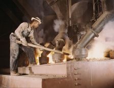 A large electric phosphate smelting furnace used to make...vicinity of Muscle Shoals, Ala., 1942. Creator: Alfred T Palmer